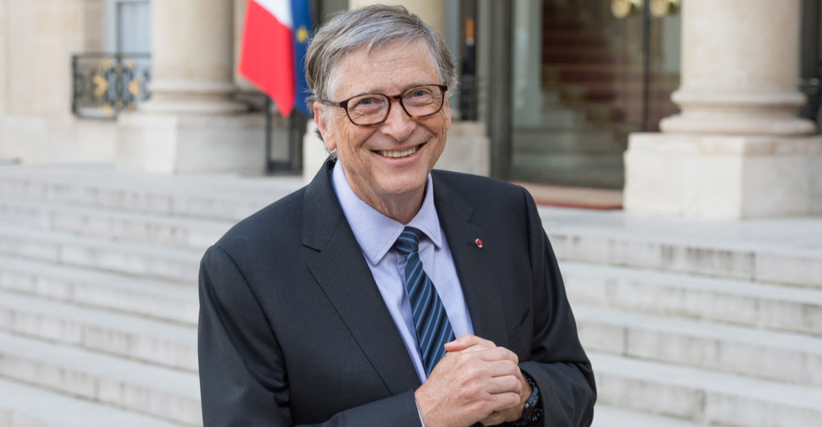 Bill Gates with French flag behind him