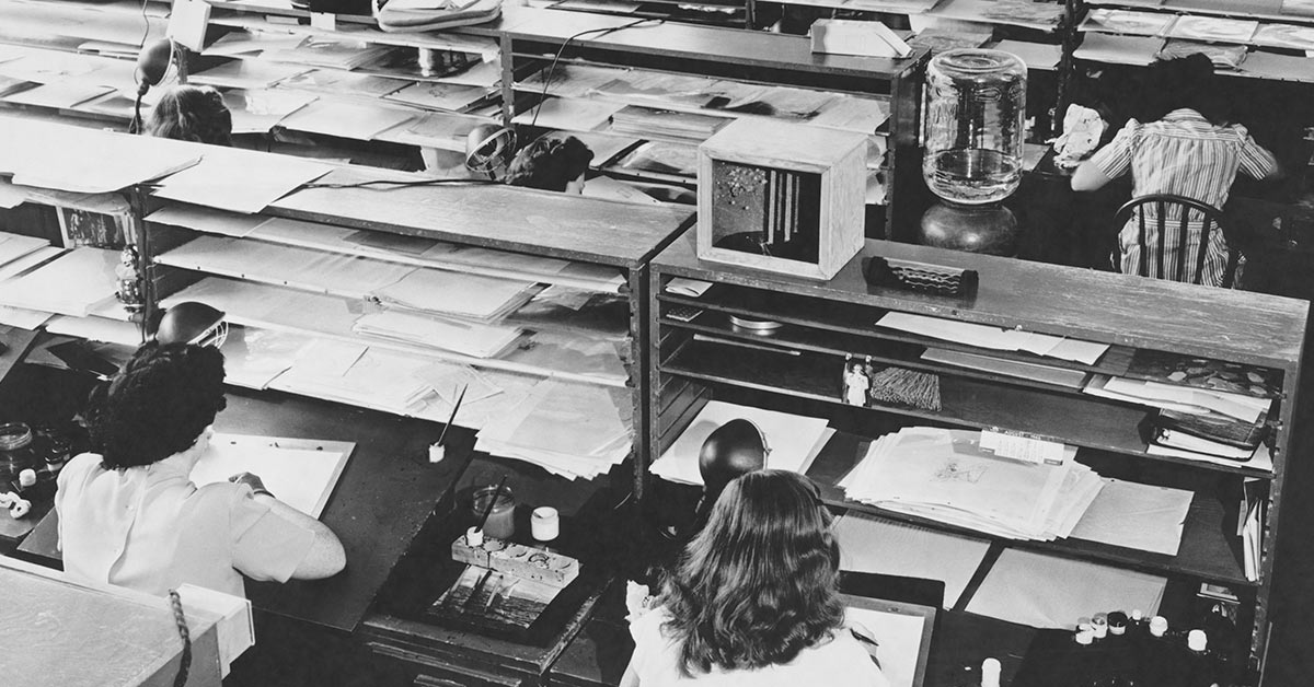 black and white image of a busy work room