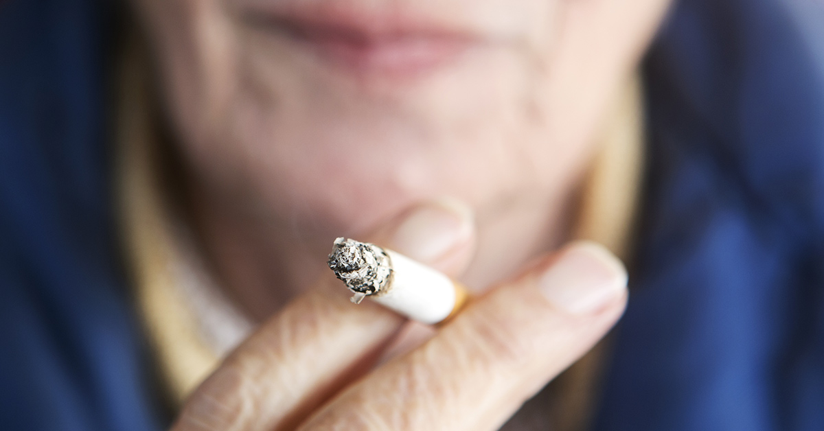 elderly person smoking a cigarette