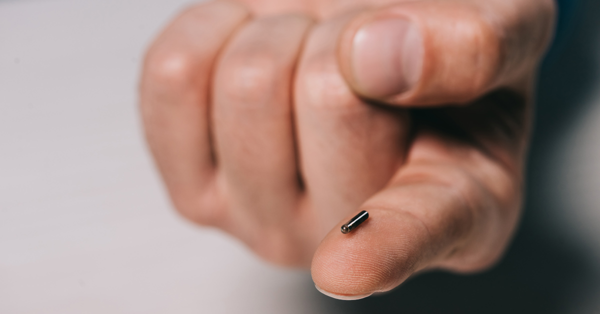small implantable microchip on the tip of an index finger